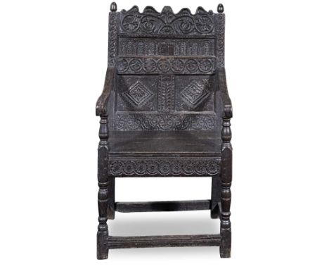 A Charles II or late 17th century carved oak panel back armchair1670-1690, of North Country originOf panelled construction, c