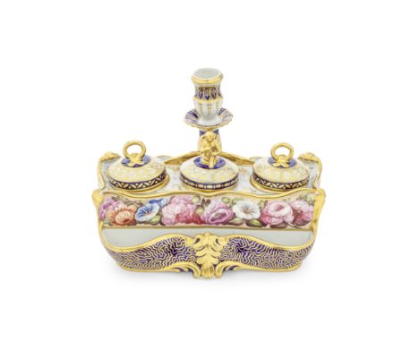 A Flight and Barr Worcester inkstand, inkwells and covers, circa 1800The elaborate scroll-edged form set with three separate 