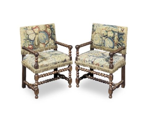 A near pair of mid 19th century Franco-Flemish walnut low armchairsin the late 17th century styleEach with associated late 17