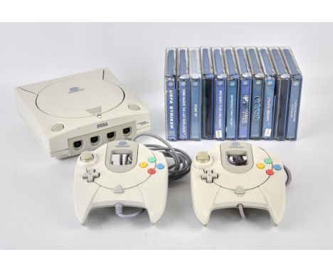 Sega Dreamcast console with 2 controllers, official power supply and 11 games Games include: Ecco the Dolphin, Stunt GP (x2),
