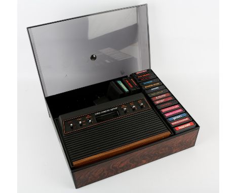 Atari CX 2600 console in a third-party storage case with cover, power supply and 19 games Games include: Kung-Fu Master, Fros