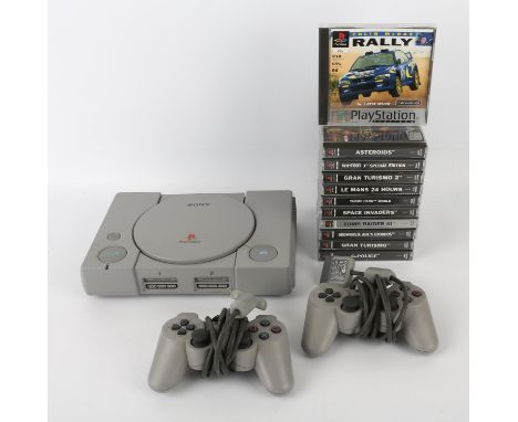 PlayStation 1 (PS1) console unboxed with 2 controllers, 11 games and power cables Games include: Gran Turismo, G-Police, Coli