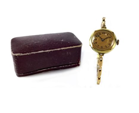 LADY'S EARLY TWENTIETH CENTURY MANUAL WIND WRIST WATCH, the round gold coloured dial with Arabic numerals in black, outer sec