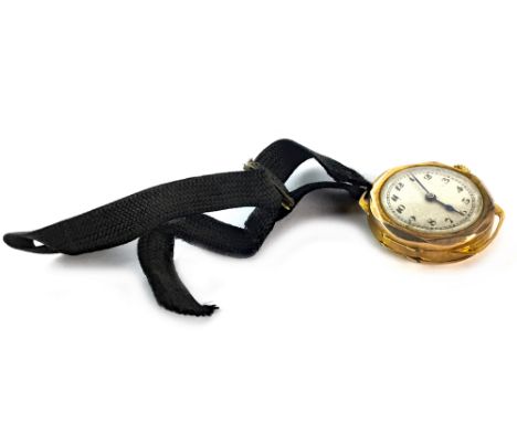 LADY'S EARLY TWENTIETH CENTURY NINE CARAT GOLD MANUAL WIND WRIST WATCH, the round buff dial with Arabic numerals in black, ou