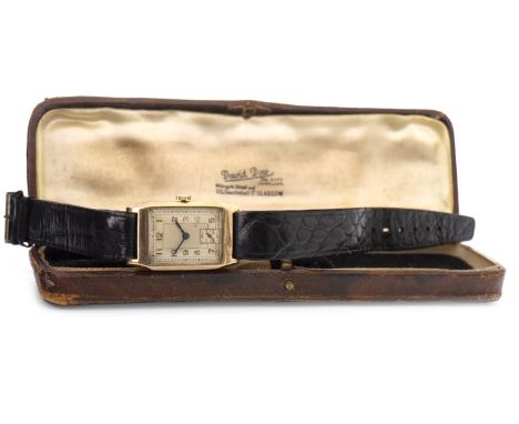 GENTLEMAN'S ART DECO NINE CARAT GOLD MANUAL WIND WRIST WATCH, the rectangular buff dial with Arabic numerals in black, outer 