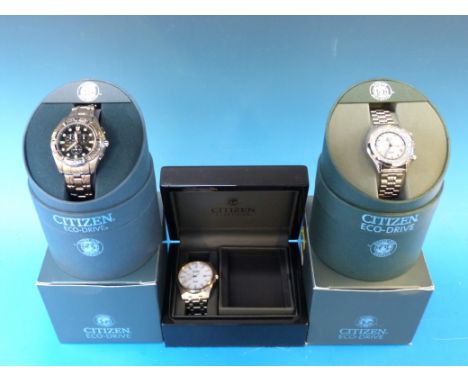 Three Citizen Eco-Drive gents wristwatches, one Sapphire WR100, one WR100 with world times and the other titanium WR200, all 