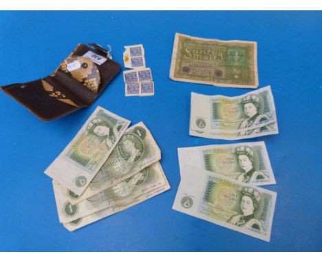 A quantity of English £1 notes, some crisp, includes a consecutive pair together with a German 50 mark note of 1919, all in a
