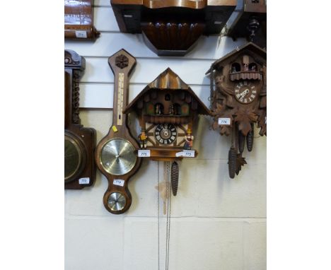 A circa 1950 three train cuckoo clock with musical dancing figures