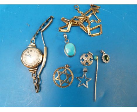 A hallmarked 9ct gold pendant, a yellow metal stick pin, four silver pendants one set with turquoise and one set with a green