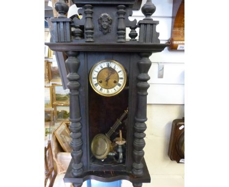 A Vienna regulator style wall clock