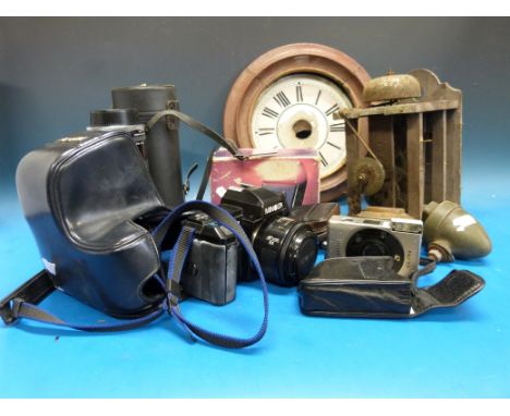 A Minolta 71000 SLR camera, Tamron zoom lens, Rollei A110 camera etc, wall clock and a pair of early motorcycle/cycle lamps, 