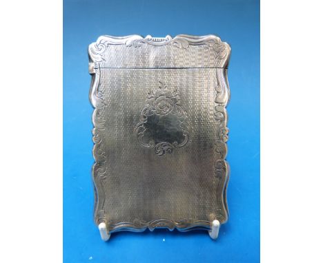 A hallmarked silver card case with shaped edge and engine turned decoration. Alfred Taylor, Birmingham 1856, length 9.5cm, 62