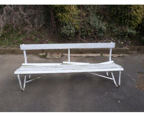 A wrought iron bench with wooden slats, length 180cm