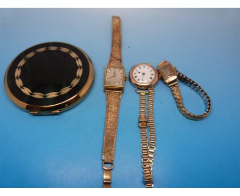 An Omega watch on a hallmarked 9ct gold strap, two hallmarked 9ct gold cased watch together with a Stratton compact 