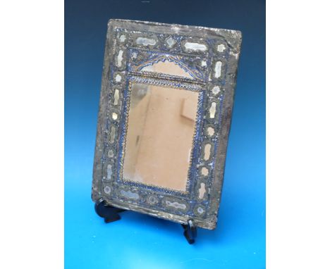 A Persian white metal and blue enamel mirror decorated with animals, birds and figures
