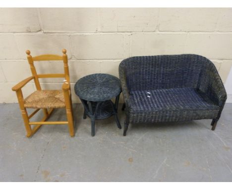 A child's wicker two seat sofa and matching table and small beech rocking chair