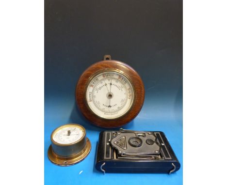 An aneroid barometer, a smaller marine example by Shortland Smith and a Rajar no 6 camera