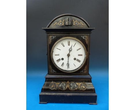 A 19thC mantel cuckoo clock with a double fusee movement and enamelled dial in an ebonised case inlaid with brass scroll work