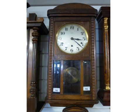 A rectangular wall clock with three train Vedette movement and three bevelled glass panels