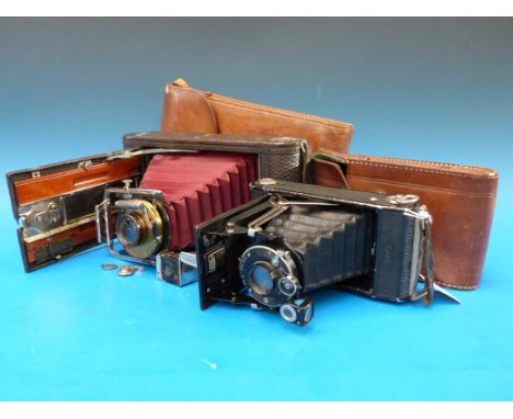 A Kodak folding bellows camera in leather case together with an Zeiss Ikon Ikonta camera