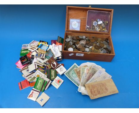 A collection of all world coins and notes, 19thC onwards, enamel badges, matchboxes etc 