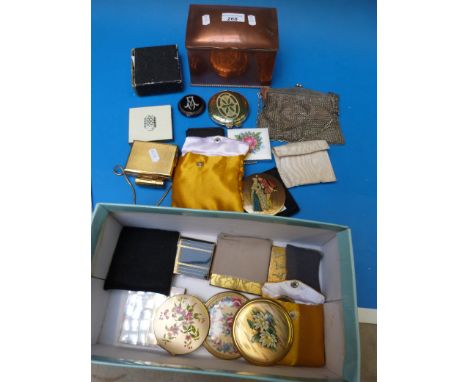 A collection of compacts including Stratton and musical examples together with an evening bag and copper caddy