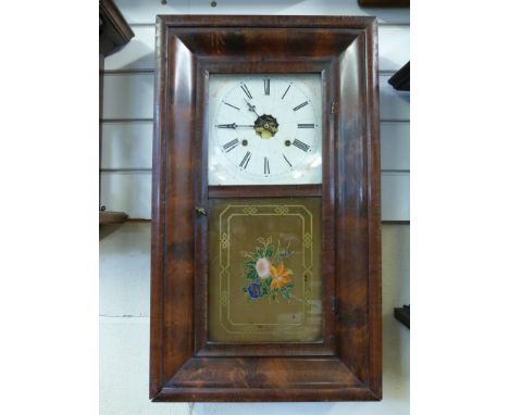 A mid to late 19thC American wall clock by Ansonia in Ogee case with painted dial and floral design to glass