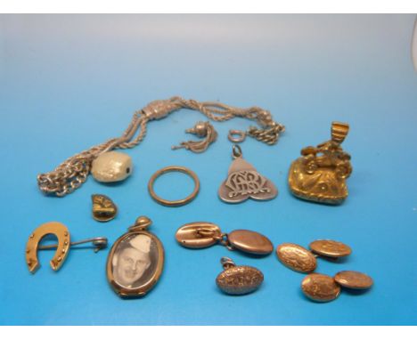 A pair of hallmarked 9ct gold cufflinks, a 9ct gold cufflink (6.5g), a hallmarked 9ct gold locket, an intaglio fob set with a