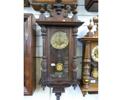 A Vienna style wall clock with two train movement and relief decoration of an owl to the dial