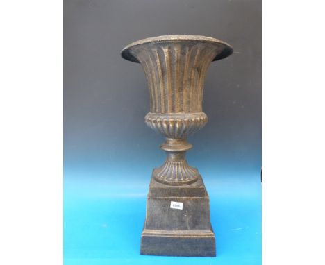 A cast iron campana shaped jardiniere or planter