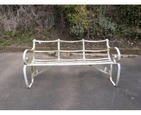 A wrought iron three seater garden bench, length 150cm, maker's plate to rear but painted over
