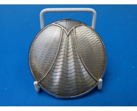 An Art Deco silver compact with circular engine-turned design, B'ham 1935, 70g all in