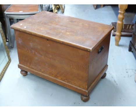 A 19thC elm trunk raised on bun feet (W84 x D48 x H62cm)