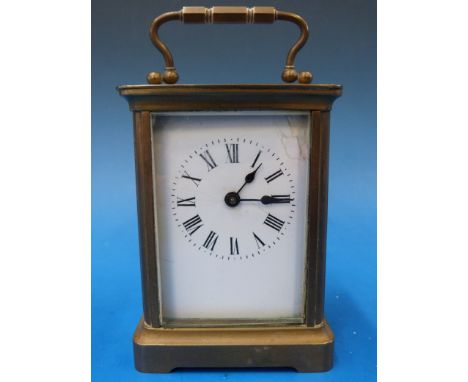 A brass cased carriage clock with enamel dial
