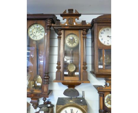 A German wall clock c1900 in the Vienna regulator style, the finial decorated with bust of gentleman in plumed hat