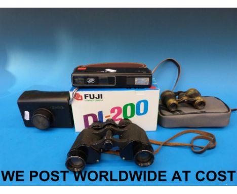 A pair of Lieberman & Gortz binoculars, a Fuji DL-200 camera, a Kodak camera etc
