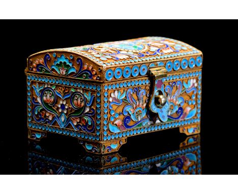 A Russian silver gilt and enamel rectangular casket on four bracket feet, the sides decorated with polychrome shaded flowers 