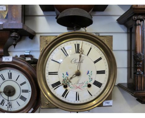 An early 19thC French chiming comptoise wall clock with lyre pendulum and hand painted floral decoration to dial