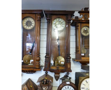 A two-train c1880 weight-driven Vienna regulator clock with ivory coloured enamelled dial and gilt chapter ring bezels, in a 