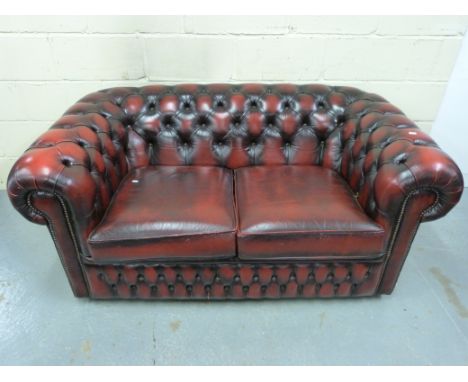 A leather Chesterfield two-seater sofa 