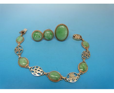 A yellow metal bracelet marked 375 set with jade and Chinese characters together with matching earrings and ring