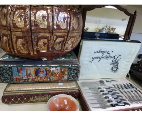Two vintage tinplate biscuit tins, cased knife set, a swing framed mirror, a leather cushion and a ceramic bowl