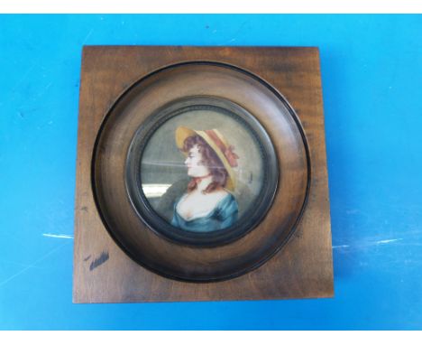 A miniature portrait of a lady wearing a bonnet, signed Driant