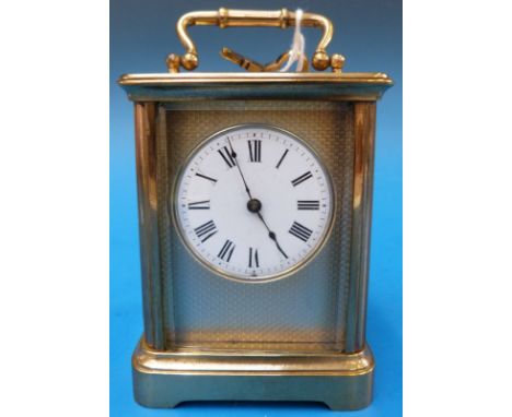 A small French carriage timepiece with engine turned dial surround