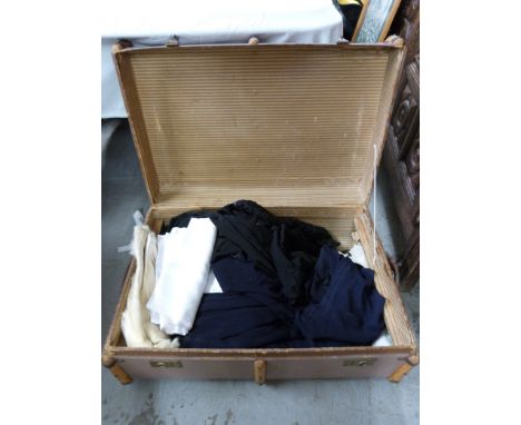 An ash bound trunk with textiles inside
