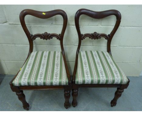 A pair of bow backed 19thC chairs with upholstered seats