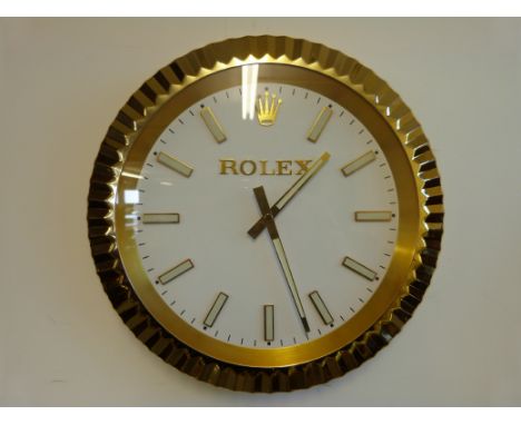 An unusual Rolex advertising wall clock in gold finish