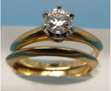 An 18ct gold Tiffany ring set with a round brilliant cut diamond of approximately 0.4ct (VS1, G) together with a matching 18c