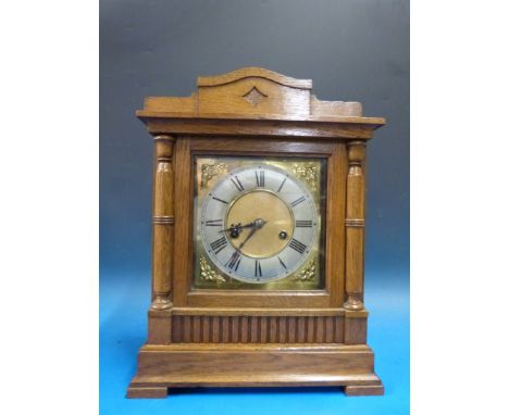 An oak cased bracket mantel clock with two train movement by Wurtenburg