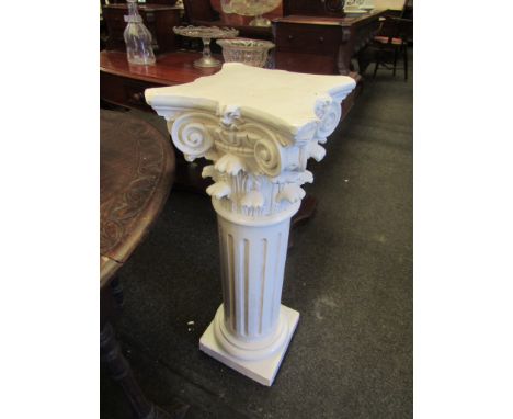 A white ceramic fluted plinth 